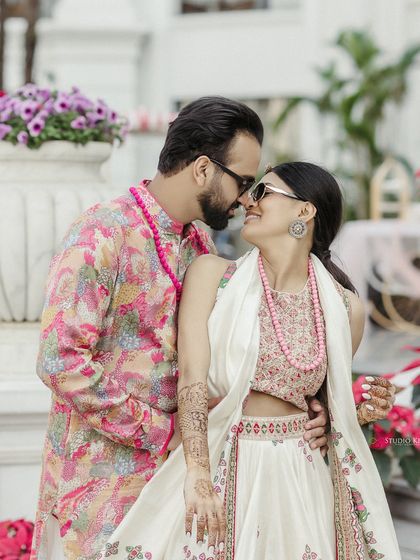 An intimate moment from a Mehendi ceremony in Vietnam, with the couple sharing a close embrace.