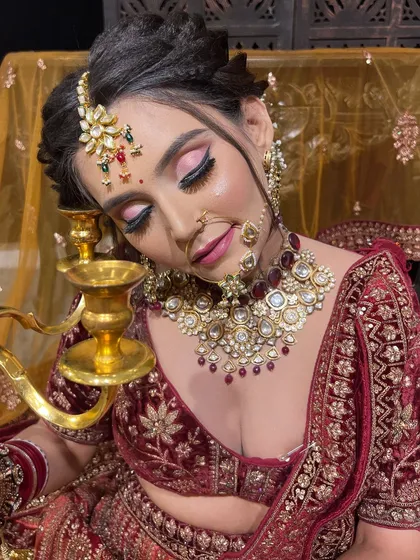 Aptly named 'Noor', this bride is glowing. This artistic shot captures the beautiful pink-toned eye makeup and the intricate details of her ruby and polki jewellery.