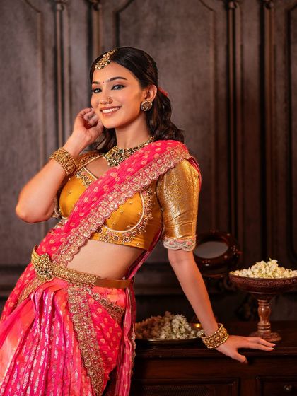 A serene and elegant look for this model, showcasing one of my classic half saree designs. The mustard yellow Kanchi blouse is paired with a pink brocade skirt and an embroidered dupatta.