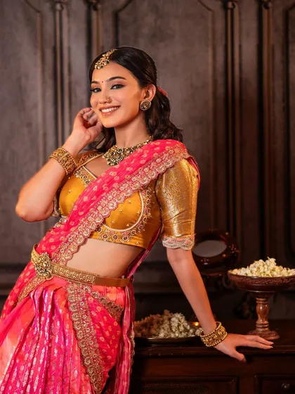 A serene and elegant look for this model, showcasing one of my classic half saree designs. The mustard yellow Kanchi blouse is paired with a pink brocade skirt and an embroidered dupatta.