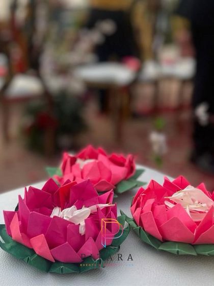 Empowering local artisans. These beautiful origami lotuses, used for the petal shower, were handcrafted by a talented artist, adding a story of resilience to the celebration.
