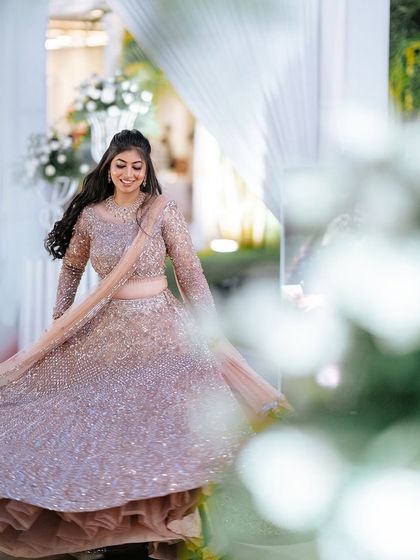 Another joyful twirling shot, capturing the movement and sparkle of her reception outfit.