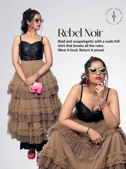 This is 'Rebel Noir'. I've paired the same faux leather bustier with a tiered nude frill skirt for a look that's both tough and feminine. The pink elephant clutch adds a quirky, unexpected pop of color.