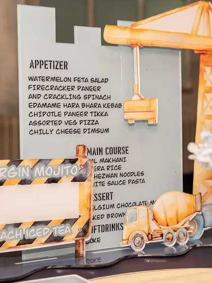The custom menu and drink sign, designed to look like a construction site, is both informative and a key part of the decor.