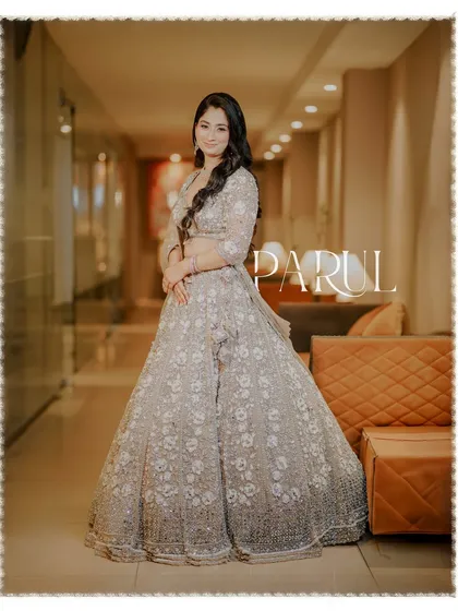 A full-length shot of the bride-to-be, capturing her elegant pose and the flow of her engagement outfit.