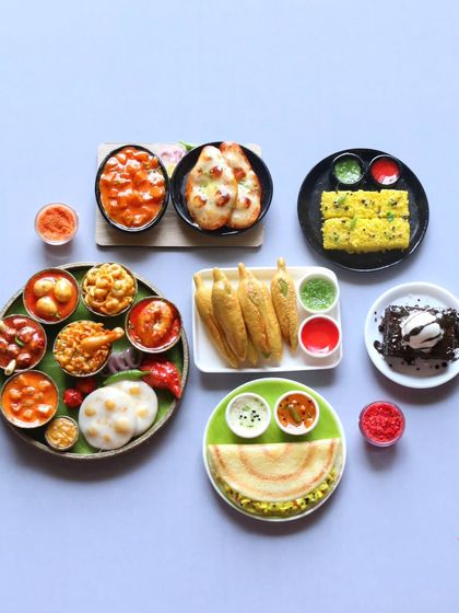 A beautiful arrangement of some of my most popular dishes, including a non-veg thali, dhokla, and dosa.