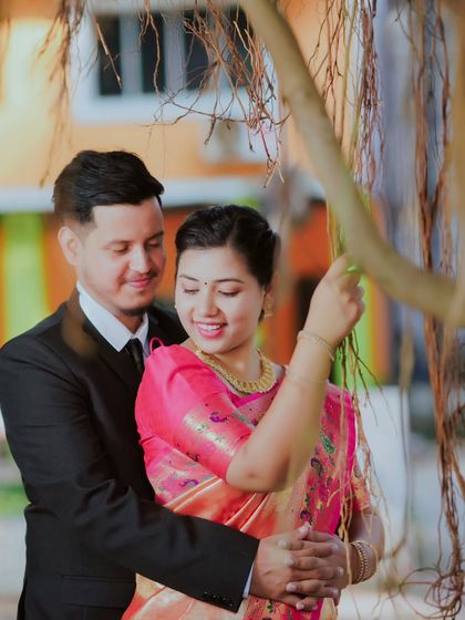 Using natural elements like the roots of a banyan tree adds an interesting and organic texture to this romantic couple portrait.