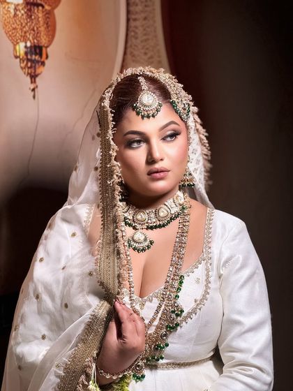 A recreation of the veteran actress Rekha's look from the classic film "Umrao Jaan". This look is all about old-world charm and timeless elegance.