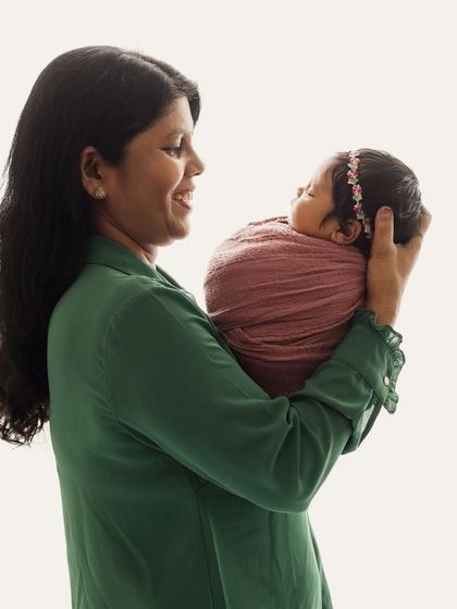 A precious moment between a grandmother and her new grandchild. I love including extended family to capture the full story of love.