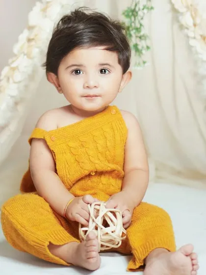A close-up portrait in the boho teepee setup. The soft lighting and natural textures make for beautiful and gentle baby photos.