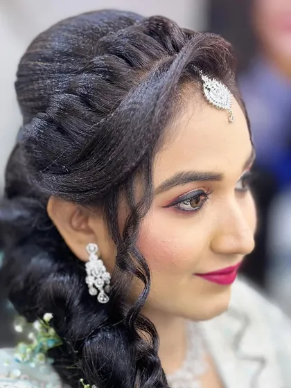 A close-up of the makeup for an engagement client, showing the detailed eye work and the elegant side-swept hairstyle.