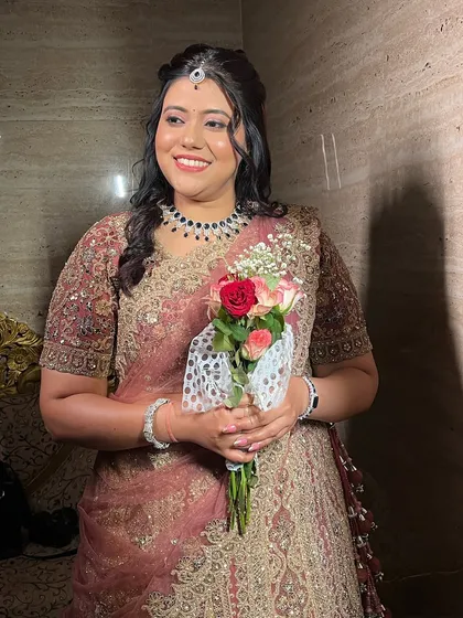 A sweet moment with the bride holding her bouquet.