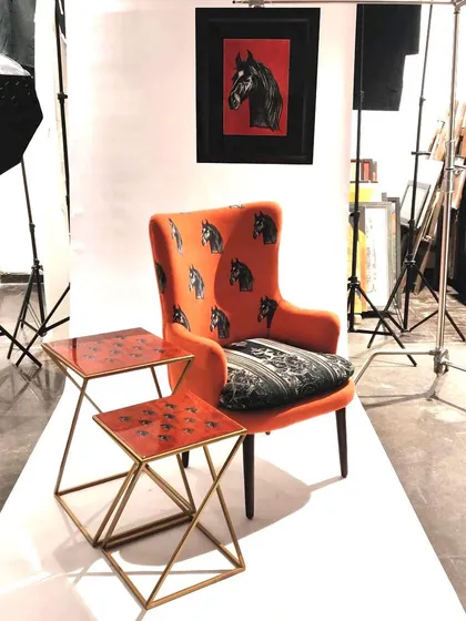 This is the Stallion Chair from my "Wild & Untamed" collection, captured during a photoshoot. I love creating bold, statement furniture that starts a conversation. The combination of the vibrant orange fabric and the graphic horse motif makes this a piece of functional art.