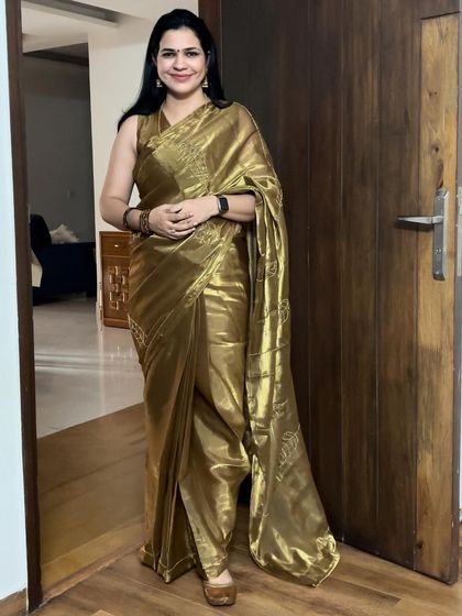 This golden tissue saree is one of my absolute favorite outfits. It makes me feel so festive and glamorous. It's a perfect example of how a single statement piece can make you shine.