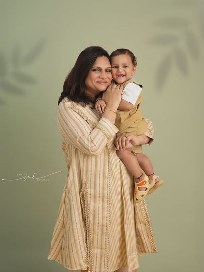 A tender hug between mother and child. This close-up portrait beautifully captures the affectionate bond and happy smiles shared during a family photoshoot.
