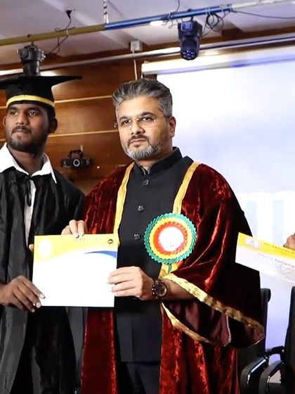 Congratulating a graduate on stage. A simple handshake can convey respect and encouragement for the journey ahead.