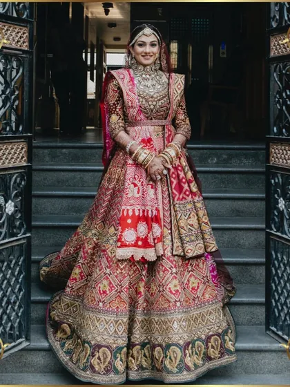 The complete bridal look. A full-length portrait showcasing the stunning detail of her traditional Gujarati wedding attire.