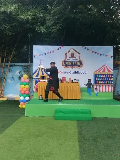 Performing a dove production trick at the Orchids Fun Fair. This illusion is a showstopper, whether performed indoors or outdoors.