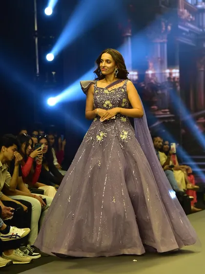 The lavender gown in all its glory on the runway. It's the perfect choice for an engagement or reception, available exclusively at my showroom.
