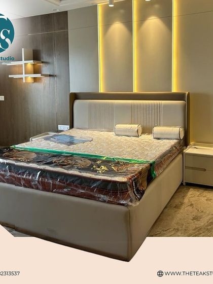 This bed set is perfect for a modern, luxurious bedroom. The neutral upholstery and clean lines are complemented by the warm, integrated wall lighting.