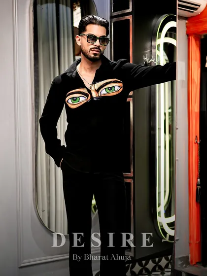 A full-length shot of the 'Haters' eyes shirt, showcasing its bold design and the confident silhouette it creates.