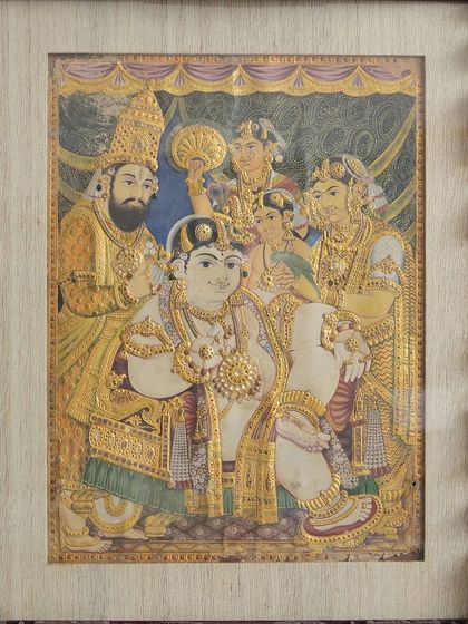'Durbar Krishna,' another traditional Tanjore painting from the 20th century. Balakrishna is portrayed in a grand, regal setting, with vibrant gold accents signifying his divine presence.