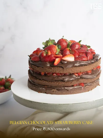 My Belgian Chocolate Strawberry Cake is a decadent dream. Layers of rich chocolate cake and ganache are topped with beautiful fresh strawberries.
