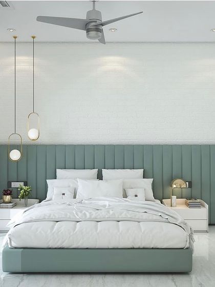 A bedroom design concept featuring a soothing sage green color scheme. The room has a channel-tufted headboard, minimalist pendant lights, and white paneled wardrobes for a clean, modern look.