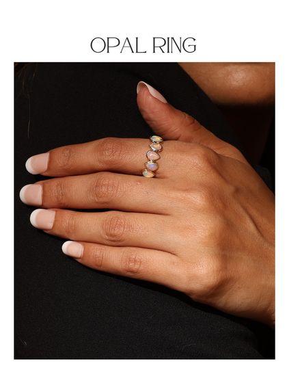 The Opal Ring from the Power Stones collection, worn on the hand. The iridescent play-of-color in the opals makes this a truly magical piece.