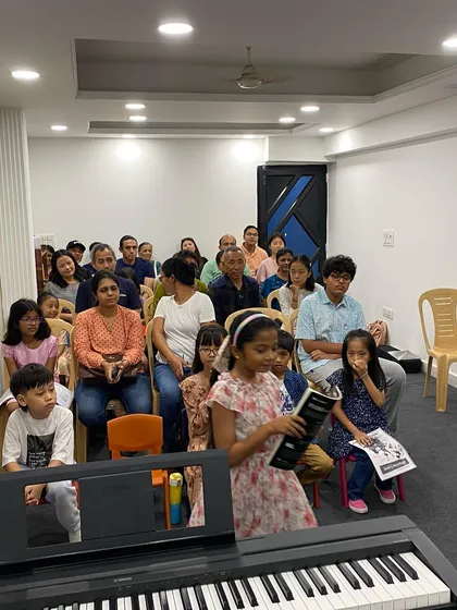 A view of the audience and a young performer at the piano during our Fall Performance Lab.