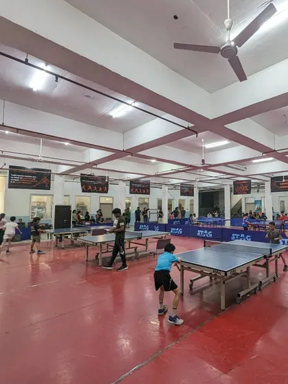 A view of our tournament hall in full swing. I ensure a professional setup with multiple STAG tables, proper flooring, and excellent lighting, creating the perfect arena for serious competition.