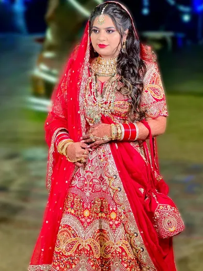 A full-length shot of the beautiful Muslim bride, Nisha, in her stunning red Nikah lehenga.