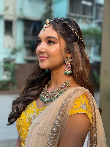 A side profile showing how the braided headband frames the face.