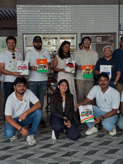 A fantastic group from a Mini Cooper event, proudly holding up their finished artworks. It was a day of combining high-energy cars with high-energy creativity.