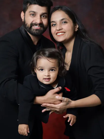 A tight, happy portrait of a young family. The love and connection between the parents and their little boy are so clear in this shot.