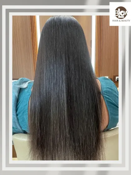 The final result of our hair smoothing treatment. The hair is incredibly straight, shiny, and healthy-looking from root to tip.