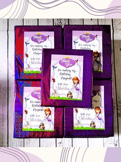 Here are the wrapped gifts for a Sofia the First party. I used themed wrapping paper and personalized tags for a cohesive look.