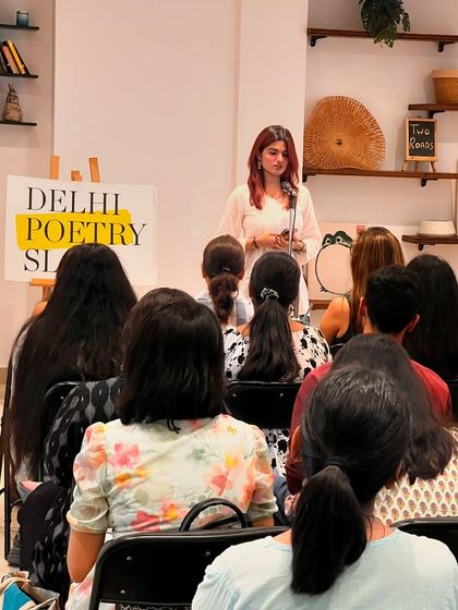 A performer connecting with the audience at our studio. The supportive environment we foster helps artists feel comfortable sharing their work.