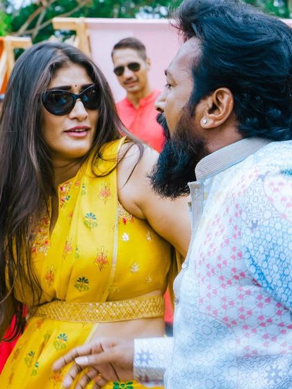 A stylish couple enjoying the music at the Coonoor destination wedding. I cater to a sophisticated crowd that appreciates a well-curated musical journey.