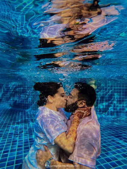 Taking the plunge, quite literally. This underwater kiss during a pool party is a perfect example of how I love to push creative boundaries to capture unique and unforgettable moments that truly reflect a couple's playful spirit.
