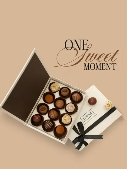 Create one more sweet moment with your sibling this Raksha Bandhan. This elegant white box holds a dozen of our finest assorted truffles, a decadent treat to cherish forever.