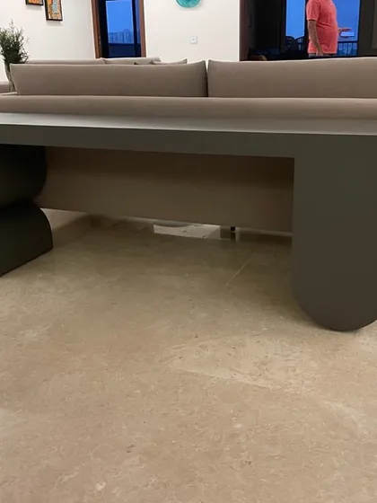 Another view of the expedited console table, highlighting its clean lines and unique, balanced form.