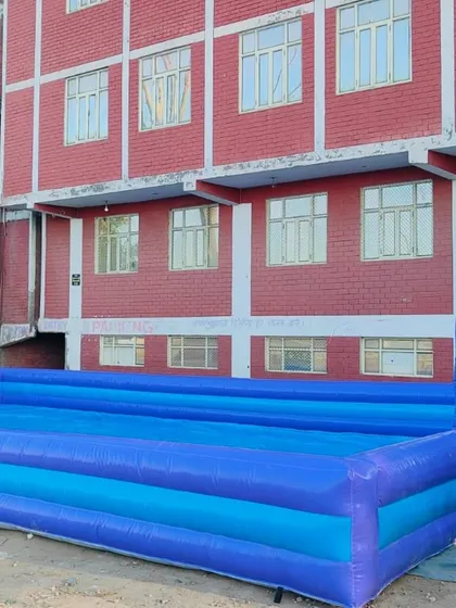 An inflatable pool structure, which can be used for soapy football or as a shallow water play area for kids.