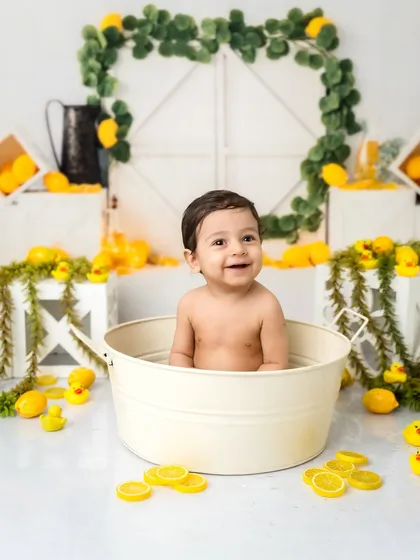 All smiles in the tub! This little one absolutely loved his splash session after his first birthday cake smash.