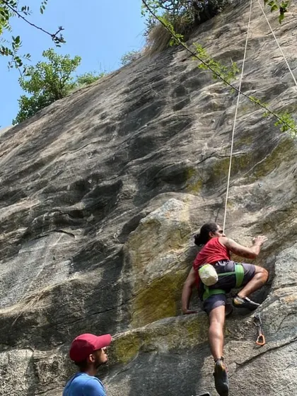 Yogi on a lead climb, with his belayer watching closely. Our community is built on trust and mutual support, which is essential for progressing in the sport.