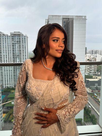 Another angle of this beautiful look. The soft waves and glowing makeup create a timeless style that photographs beautifully.