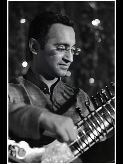 A close-up black and white portrait, highlighting my expression while playing.