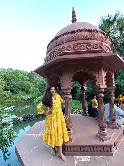 This bright yellow bandhani print dress is a perfect example of my custom nursing wear. It features concealed zippers for easy feeding, designed to be both stylish and practical for new mothers.
