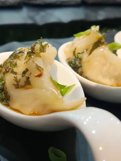 Chicken gyoza with a chimichurri-style dressing. We elevate classic dishes with our own unique twists, making them memorable for your guests.