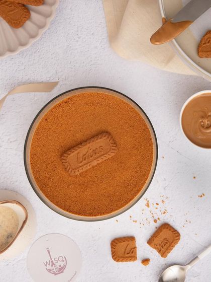 An overhead shot of my Biscoff Tiramisu, showing the smooth, even layer of Biscoff crumble that covers the creamy dessert beneath.